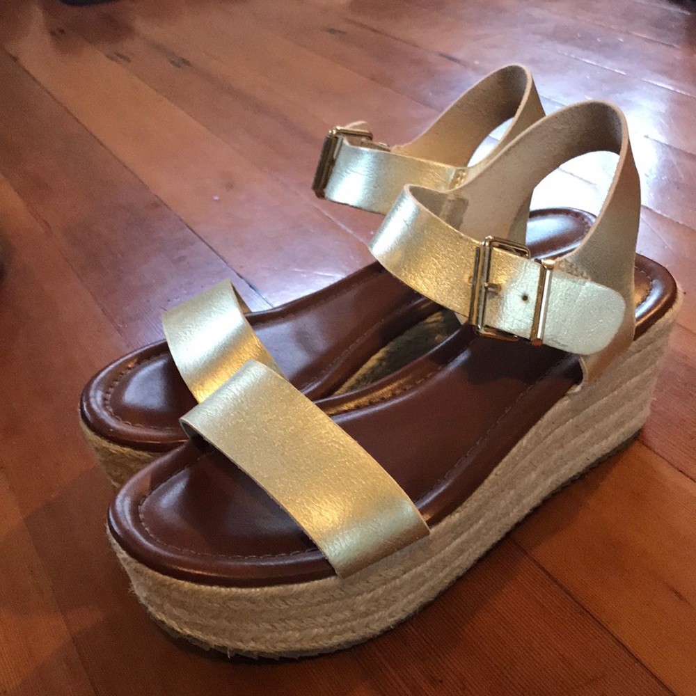 Gold platform espadrilles.